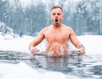 man in pool in winter