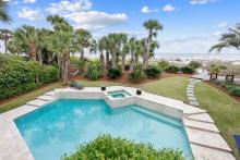 hilton head property with a view of pool and hot tub