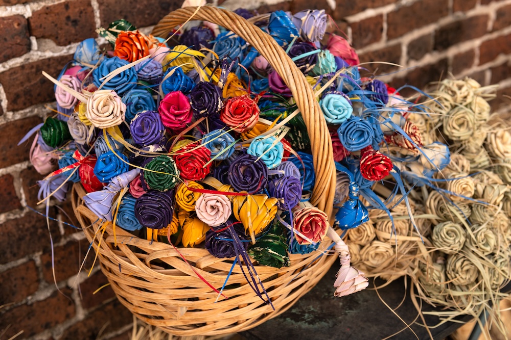 colorful palmetto roses in a grass-woven basket