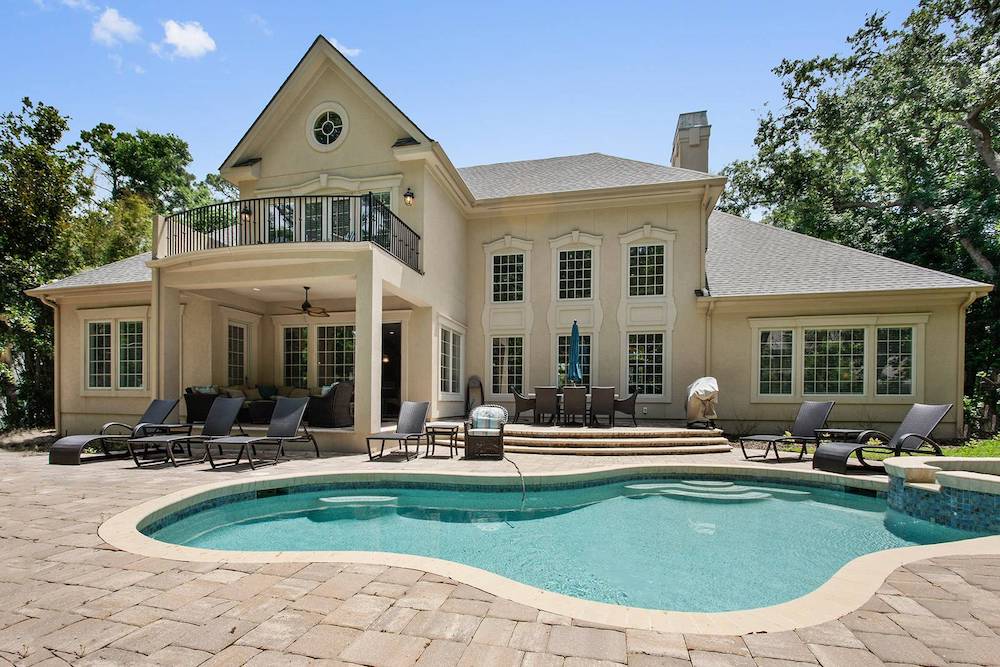 view of Hilton Head home exterior featuring in-ground pool