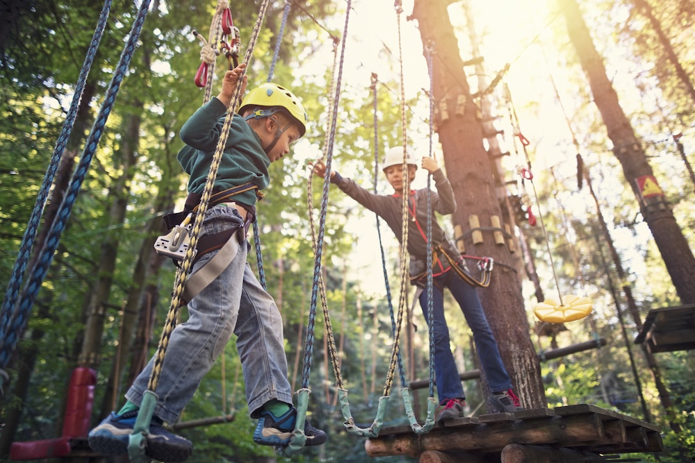 two young boys on a ropes course 